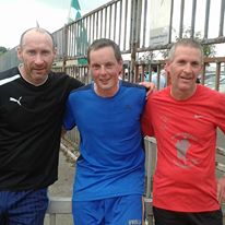 Track-Attackers Tom Shanahan, Michael Murray and John F Kennedy